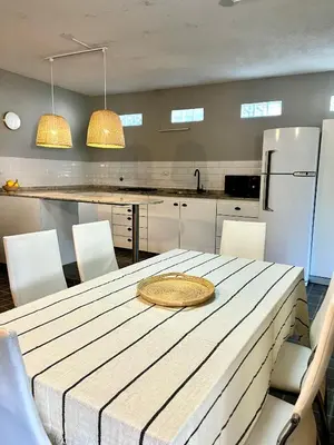 a kitchen with a table with a plate on it at Casa alquiler temporario, Cerro, Córdoba in Cordoba