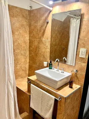 a bathroom with a sink and a mirror at Casa alquiler temporario, Cerro, Córdoba in Cordoba