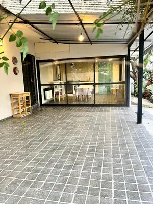 an open patio with a table and chairs on it at Casa alquiler temporario, Cerro, Córdoba in Cordoba