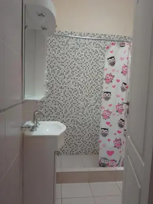 a bathroom with a sink and a shower curtain at Casa Miranda in Merlo