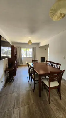 a dining room with a wooden table and chairs at El Descanso Placentero 3 Habitaciones in Cordoba