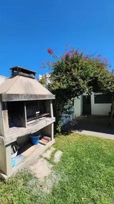 a bird house sitting in the grass in a yard at El Descanso Placentero 3 Habitaciones in Cordoba