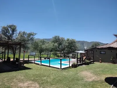 a swimming pool in the yard of a house at Bella Vista in Bialet Massé