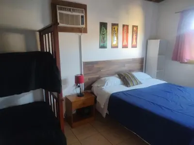 a bedroom with a bed and a air conditioner at Bella Vista in Bialet Massé