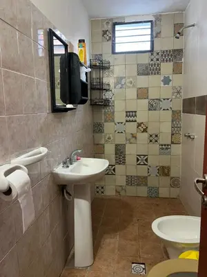 a bathroom with a sink and a toilet at Casita de los recuerdos in Villa Carlos Paz