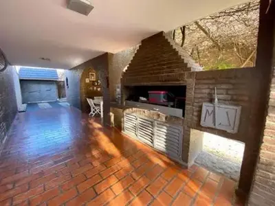 a large living room with a brick fireplace at Gravensteen Urca in Cordoba