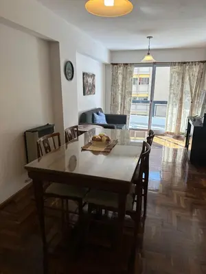 a living room with a table and chairs and a couch at Mandala Apart in Cordoba