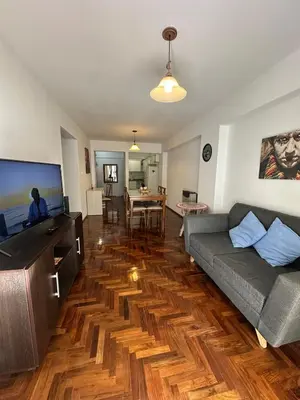 a living room with a couch and a table at Mandala Apart in Cordoba