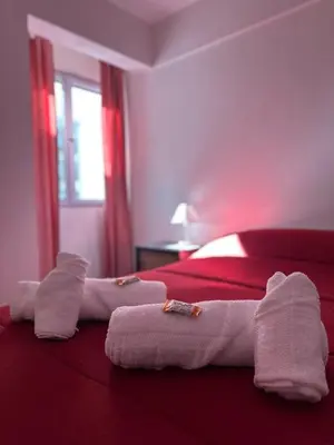 a hotel room with towels on a bed at Mandala Apart in Cordoba