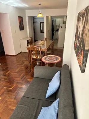 a living room with a couch and a table at Mandala Apart in Cordoba