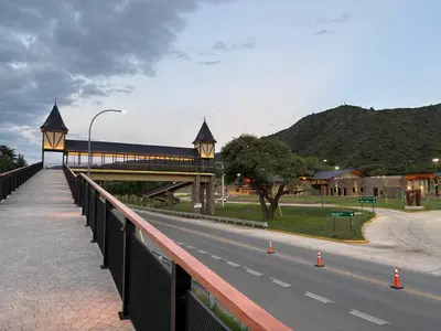 a bridge over a road next to a street at Dos Osos in Villa General Belgrano