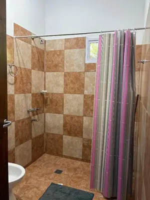 a bathroom with a shower and a sink at Dos Osos in Villa General Belgrano