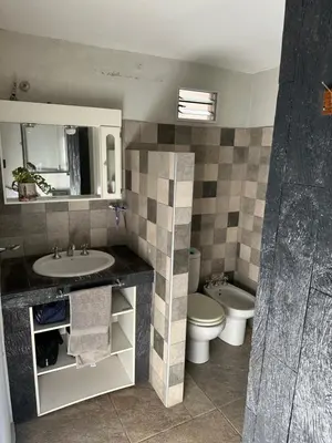 a bathroom with a sink and a toilet at Sierra Chica in Alta Gracia