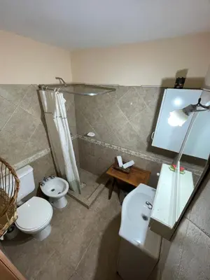 a bathroom with two toilets and a shower at Sierra Chica in Alta Gracia