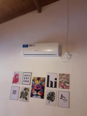 a wall with pictures and a air freshener on it at Lomas de Belgrano in Villa General Belgrano