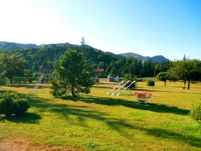 a park with a swing set in a field at Lomas de Belgrano in Villa General Belgrano