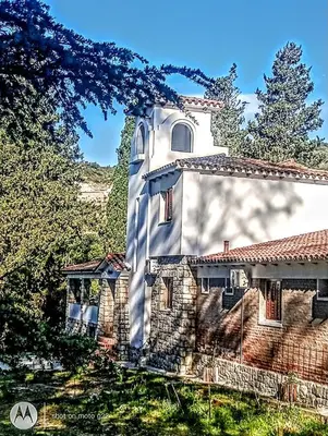 a building with a tower on the side of it at Madaro House in San Antonio de Arredondo