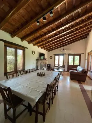 a large dining room with a large table and chairs at La Buyi, Casa de Campo mirando al Champaqui in San Javier