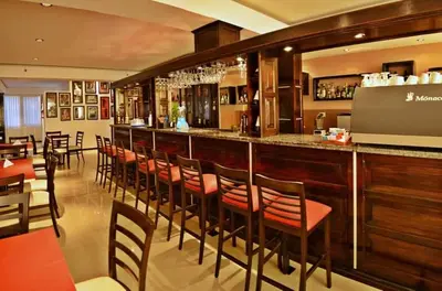 a bar with a row of chairs at a restaurant at El Condor Hotel SPA in Merlo