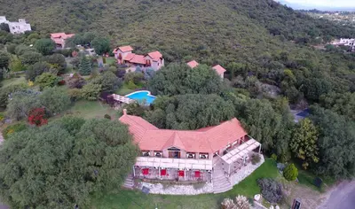 an aerial view of a large house on a hill at Complejo Pasos Malos in Merlo