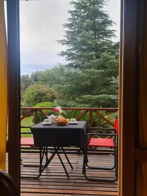 a table with a black table cloth on a deck at Complejo Pasos Malos in Merlo