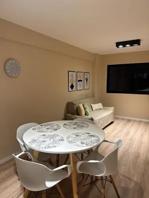 a living room with two tables and a couch at Central & Comfy Apt in Córdoba in Cordoba