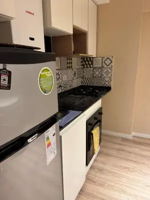 a kitchen with a stove and a counter top at Central & Comfy Apt in Córdoba in Cordoba