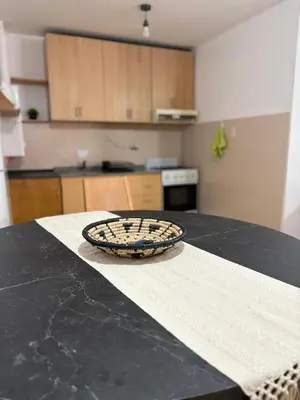 a kitchen counter with a bowl on top of a table at Bv Illia - 1 dormitorio Bº Nueva Córdoba in Cordoba