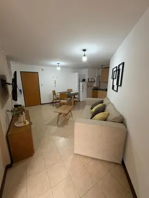 a living room with a couch and a table at Bv Illia - 1 dormitorio Bº Nueva Córdoba in Cordoba