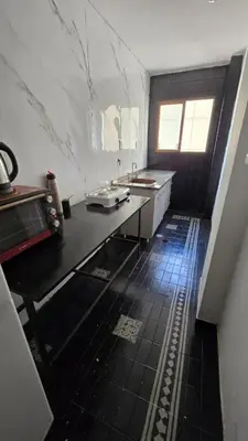 a kitchen with a sink and a counter top at Elegante Depto 1 dorm pleno centro! in Cordoba
