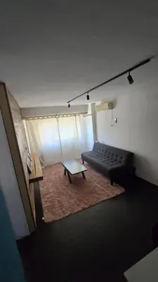 a living room with a couch and a coffee table at Elegante Depto 1 dorm pleno centro! in Cordoba