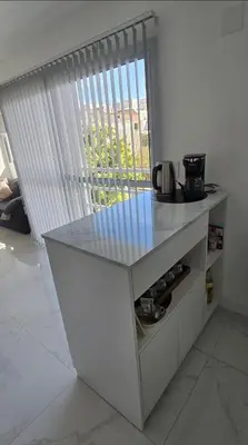 a kitchen with a counter and a window with a view at apartamento in Cordoba