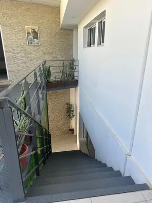a stairway in a building with a stair case at departamentos apart quetzal in Villa Carlos Paz