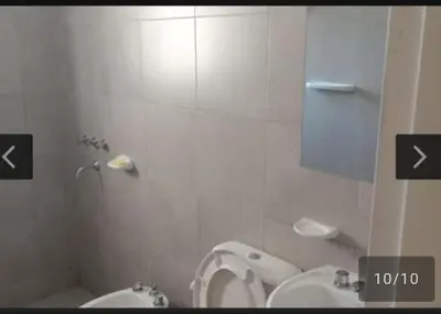 a bathroom with a toilet and a urinal and a sink at San Antonio de Arredondo in San Antonio de Arredondo