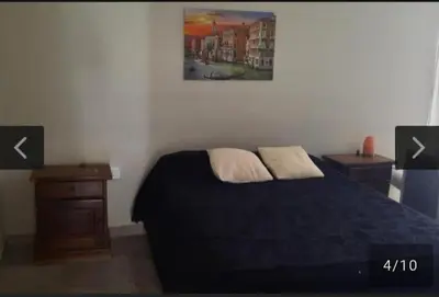 a bedroom with a bed and a painting on the wall at San Antonio de Arredondo in San Antonio de Arredondo