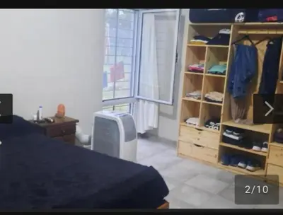 a bedroom with a bed and a dresser with shoes at San Antonio de Arredondo in San Antonio de Arredondo