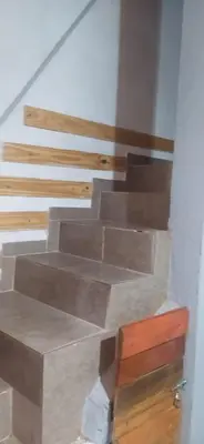 a set of wooden stairs in a building at La Casita del Hada in Santa María