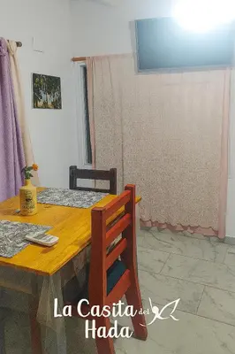a table and two chairs in a room at La Casita del Hada in Santa María