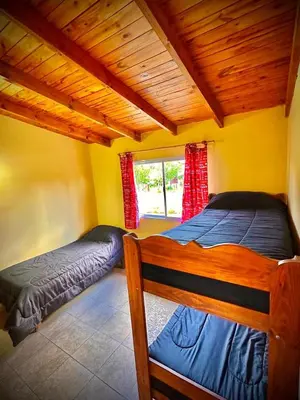 a bedroom with two beds and a window at Koonex in Los Reartes