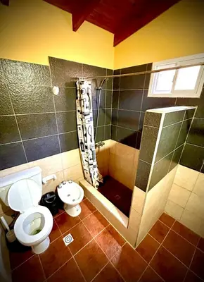 a bathroom with a toilet and a shower at Koonex in Los Reartes