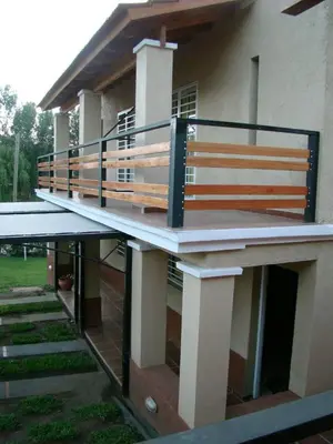 a balcony on a house with a railing at CastelAnte in Villa Carlos Paz