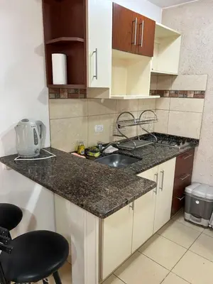 a kitchen with a sink and a counter top at CastelAnte in Villa Carlos Paz