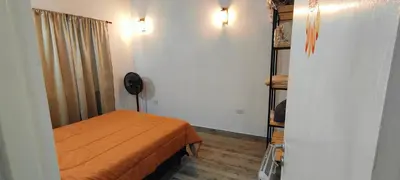 a small room with a bed and a closet at Antar Mouna in Cortaderas