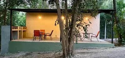 a group of chairs and a table in a house at Complejo Baren in Villa Ciudad Parque
