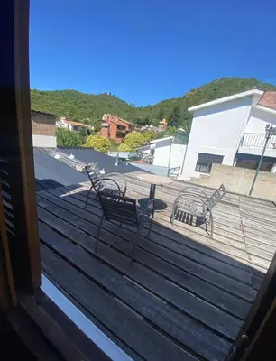 a view from a window of a deck with benches at Lo de Alicia 2 in Villa Carlos Paz