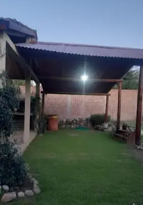 a roof over a yard with a light under it at La casa de Milac in Mina Clavero