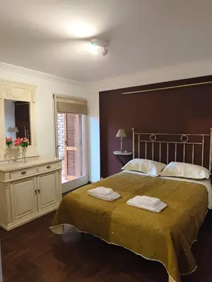 a bedroom with a large bed with two towels on it at Departamento en calle Obispo Trejo in Cordoba