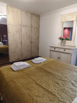 a bedroom with a large bed with two towels on it at Departamento en calle Obispo Trejo in Cordoba