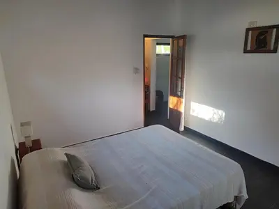 a bedroom with a bed with a pillow on it at Espacio Colibrí in San Francisco del Monte de Oro