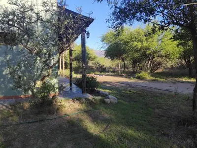 a house with a pole in the middle of a yard at Espacio Colibrí in San Francisco del Monte de Oro